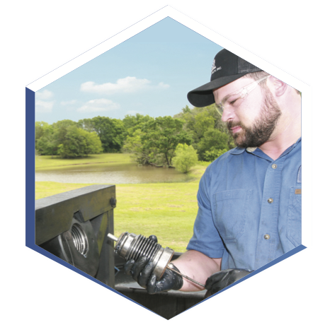 Mecano-Tech field technician inspecting energetic component equipment